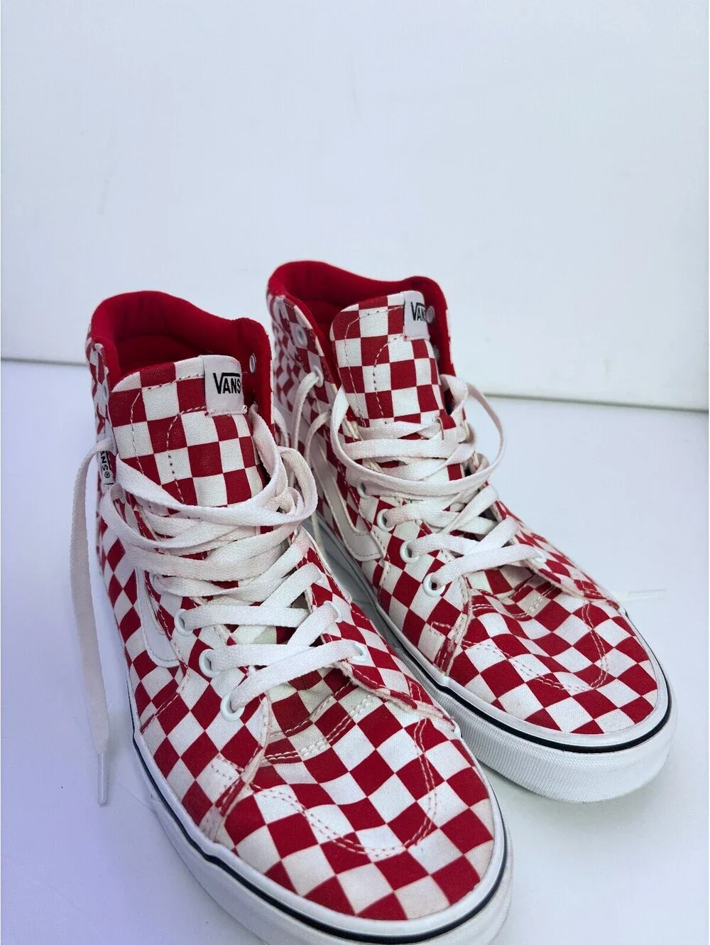 Vans red and white checkerboard high top sneakers